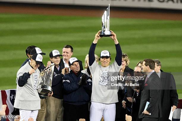 World Series MVP Hideki Matsui of the New York Yankees holds up the MVP trophy as he celebrates their 7-3 win against the Philadelphia Phillies in...