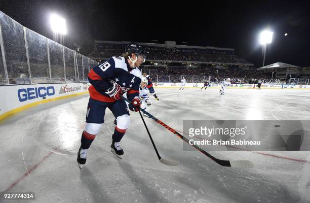 Nicklas Backstrom of the Washington Capitals backhands a centering pass during the 2018 Coors Light NHL Stadium Series game between the Toronto Maple...
