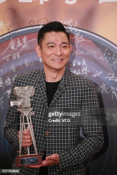 Actor Andy Lau poses with trophy during the 30th anniversary ceremony of Hong Kong Society of Cinematographers on March 5, 2018 in Hong Kong, China.