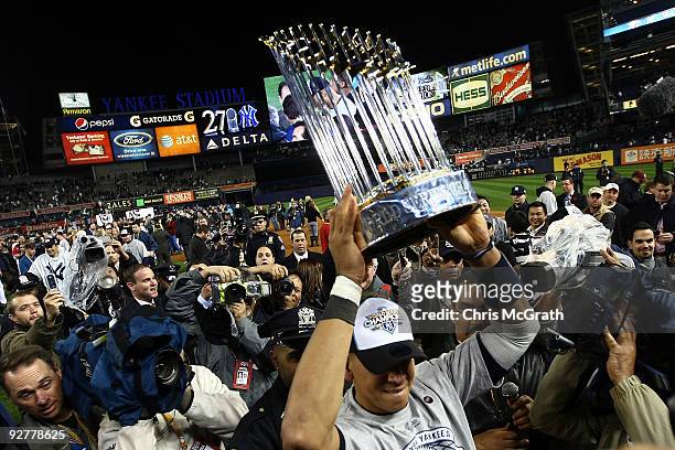Alex Rodriguez of the New York Yankees celebrates with the trophy after their 7-3 win against the Philadelphia Phillies in Game Six of the 2009 MLB...