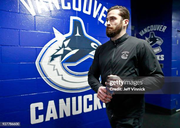 Erik Gudbranson of the Vancouver Canucks walks past the Canucks dressing room before their NHL game against the New York Islanders at Rogers Arena...