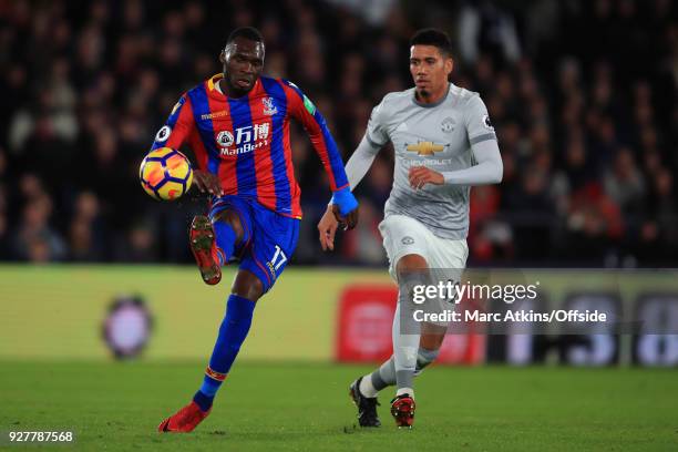 Christian Benteke of Crystal Palace in action with Chris Smalling of Manchester United during the Premier League match between Crystal Palace and...