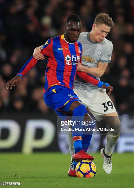 Christian Benteke of Crystal Palace in action with Scott McTominay of Manchester United during the Premier League match between Crystal Palace and...