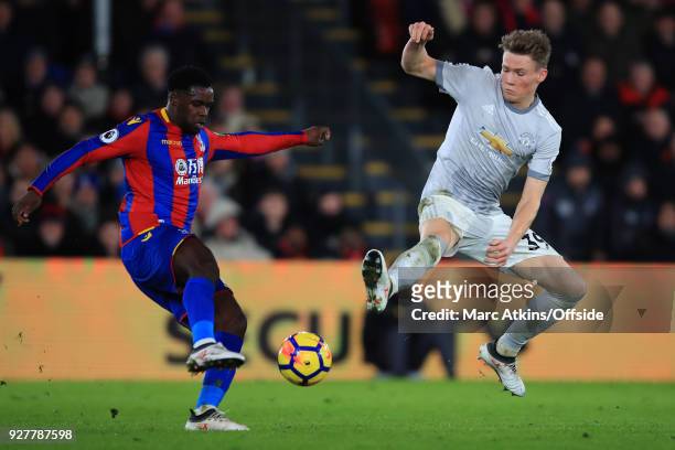 Jeffrey Schlupp of Crystal Palace in action with Scott McTominay of Manchester United during the Premier League match between Crystal Palace and...