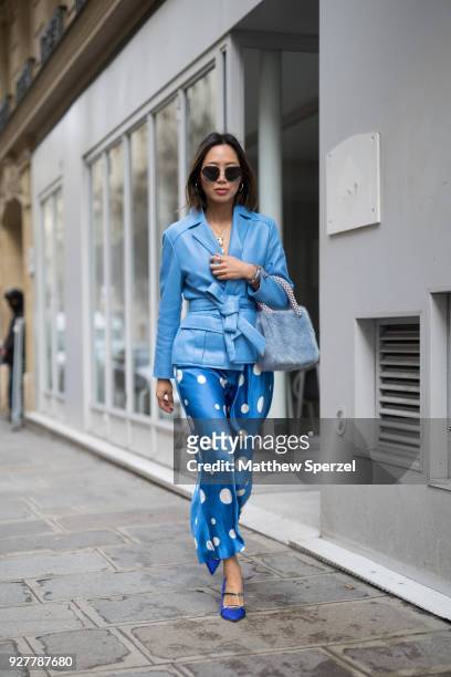 Aimee Song is seen on the street attending Sacai during Paris Women's Fashion Week A/W 2018 wearing an all-blue outfit with polka dot pants on March...