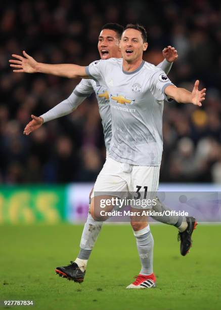 Nemanja Matic celebrates his late winning goal with Chris Smalling during the Premier League match between Crystal Palace and Manchester United at...