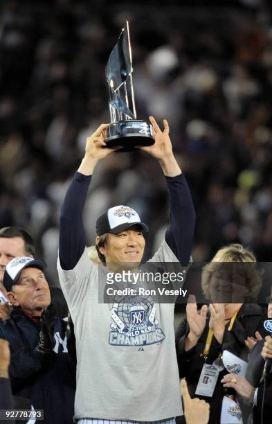 Hideki Matsui of the New York Yankees holds up the World Series MVP trophy after the Yankees 7-3 win against the Philadelphia Phillies in Game Six of...
