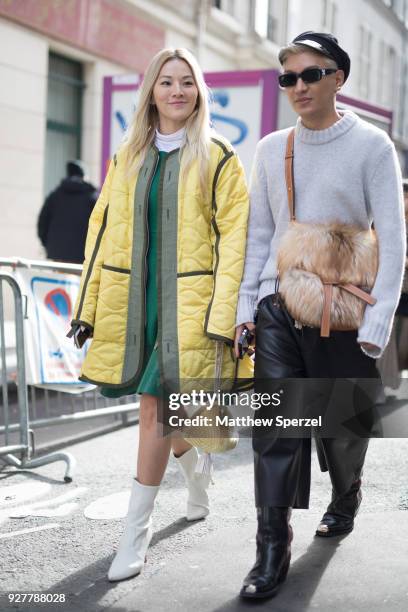 Tina Leung and Bran Boy are seen on the street attending Sacai during Paris Women's Fashion Week A/W 2018 on March 5, 2018 in Paris, France.