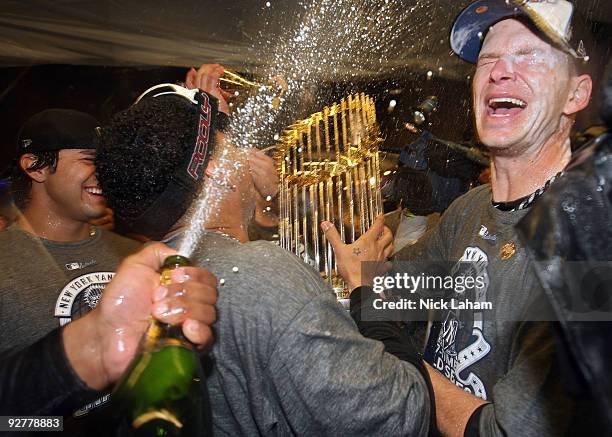 Burnett of the New York Yankees celebrates in the locker room after their 7-3 win against the Philadelphia Phillies in Game Six of the 2009 MLB World...