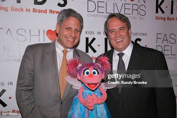 Humanitarian Award recipient and Sesame Workshop CEO Gary Knell, Muppet Abby Cadabby and President and CEO of Gerber Childrenswear LLC Gary Simmons...