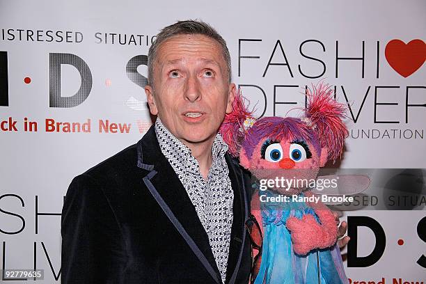 Master of Ceremonies and the Creative Director of Barney's NY Simon Doonan with Sesame Street Muppet Abby Cadabby attend the 2009 KIDS/Fashion...