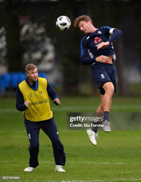 England player Jos Buttler wins a header watched by Joe Root during a game of Football during an England training session ahead of the 4th ODI v New...