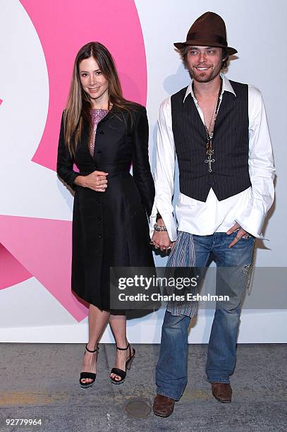 Actress Mira Sorvino and husband Christopher Backus attend the Isaac Mizrahi Live! collection launch celebration at Stage 37 on November 4, 2009 in...