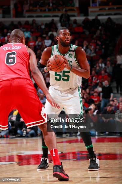 Jonathan Holmes of the Boston Celtics handles the ball against the Chicago Bulls on March 5, 2018 at the United Center in Chicago, Illinois. NOTE TO...