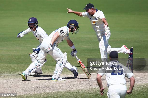 Cameron White of Victoria celebrates winning the match after Peter Neville of New South Wales is stumped by keeper Seb Gotch of Victoria during day...