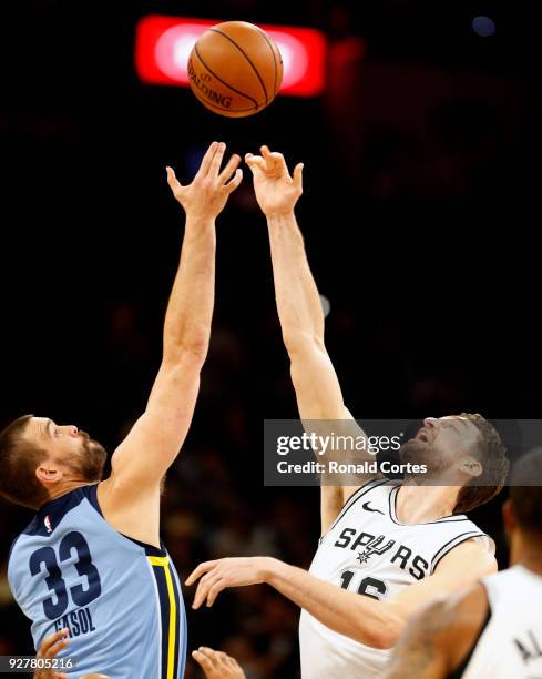 Marc Gasol of the Memphis Grizzlies jumps for the ball against his brother Pau Gasol of the San Antonio Spurs at AT&T Center on March 5, 2018 in San...