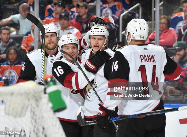 Kevin Connauton, Max Domi, Christian Dvorak and Richard Panik of the Arizona Coyotes celebrate after a goal during the game against the Edmonton...