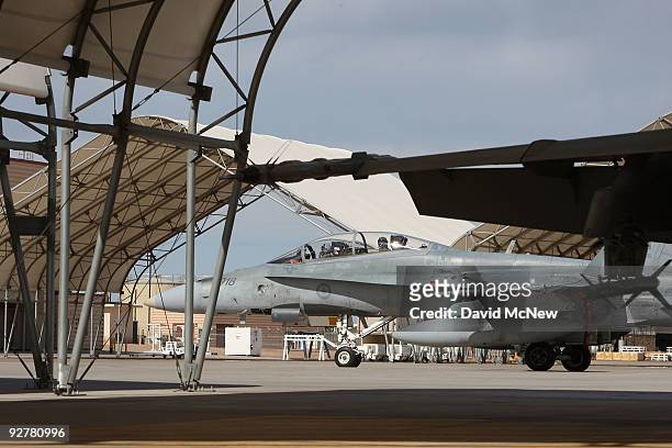 Pilots with the Canadian 410 'Couger' Squadron return to base after a training flight in CF-18 Hornet fighter jets at Naval Air Facility El Centro on...