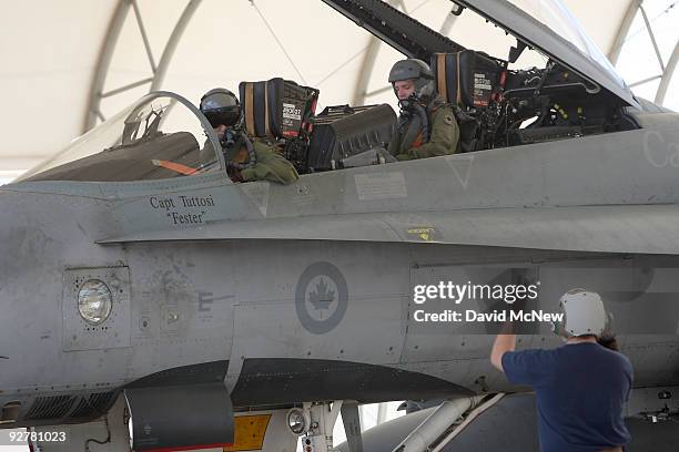 Pilots with the Canadian 410 'Couger' Squadron return to base after a training flight in CF-18 Hornet fighter jets at Naval Air Facility El Centro on...