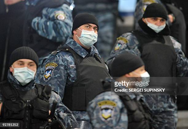 Picture taken on November 4, 2009 shows riot policemen, wearing protective masks during a UEFA Champions League match, Group F football match FC...
