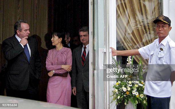 Myanmar democracy icon Aung San Suu Kyi talks with US Assistant Secretary of State for East Asian and Pacific Affairs Kurt Campbell following their...