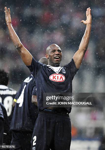 Bordeaux' French defender Michael Ciani celebrates with supporters after Bordeaux' Moroccan striker Marouane Chamakh scored a second goal during the...