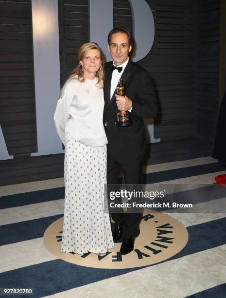 Dominique Lemmonier and Alexandre Desplat attend the 2018 Vanity Fair Oscar Party hosted by Radhika Jones at Wallis Annenberg Center for the...