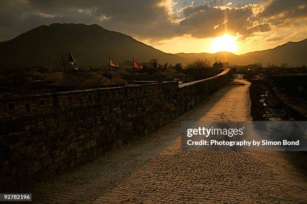 sunrise at the folk village - suncheon stock pictures, royalty-free photos & images