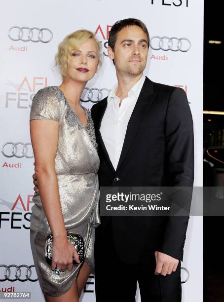 Actress Charlize Theron and boyfriend actor Stuart Townsend arrive at the AFI FEST 2009 screening of "The Road" at the Chinese Theater on November 4,...
