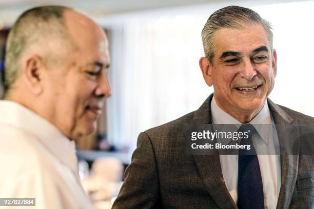 Jaime Augusto Zobel de Ayala, chairman and chief executive officer of Ayala Corp., right, speaks as Erramon Aboitiz, chief executive officer of...
