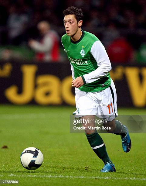 Mesut Oezil of Bremen runs with the ball during the DFB Cup round of 16 match between between Werder Bremen and 1. FC Kaiserslautern at the Weser...