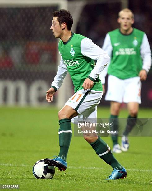 Mesut Oezil of Bremen runs with the ball during the DFB Cup round of 16 match between between Werder Bremen and 1. FC Kaiserslautern at the Weser...