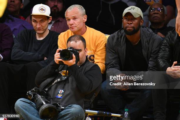 Musician Flea and actor Trevante Rhodes attend a basketball game between the Los Angeles Lakers and Portland Trail Blazers at Staples Center on March...