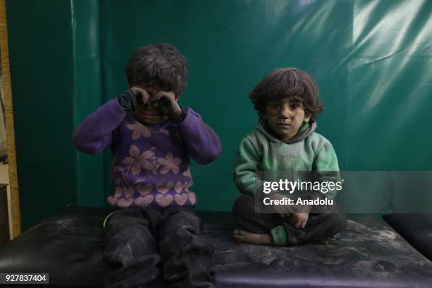 Syrian kids are seen after receiving medical treatment at the field hospital after Assad Regime's alleged chlorine gas attack in Hamouriyah district...