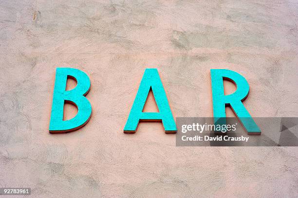 bar sign on  a wall. - crausby stockfoto's en -beelden