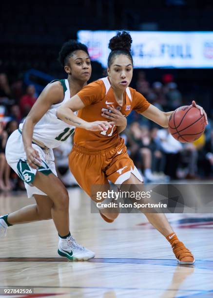 Texas Brooke McCarty making her move towards the basket while Baylor Alexis Morris plays defense during the Big 12 Women's Championship on March 05,...