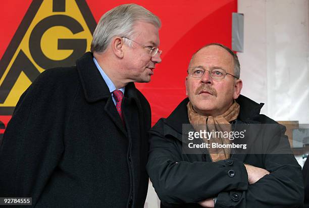 Roland Koch, prime minister of the German state of Hessen, left, speaks to Klaus Franz, chairman of the Opel workers' council, at a demonstration by...