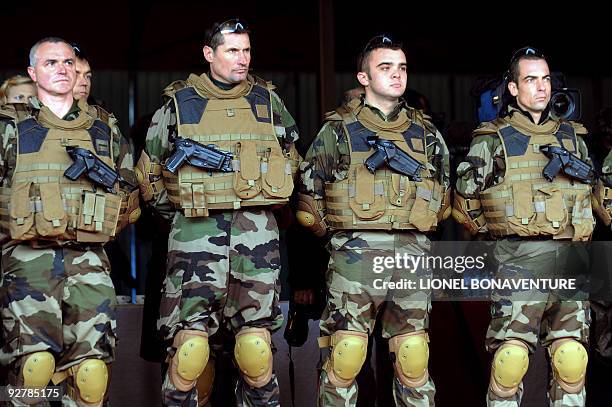 French military officers, wearing a bullet proof vest, listen to the speech of French Interior Ministor Brice Hortefeux on November 3, 2009 at the...