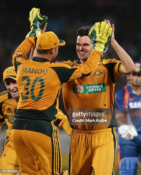 Clint McKay of Australia celebrates with his team mates after taking his first one day international wicket during the fifth One Day International...