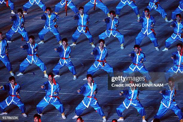 Athletes perform martial arts during the opening ceremony of the 3rd Asian Indoor Games at Hanoi's My Dinh stadium on October 30, 2009. Vietnam host...