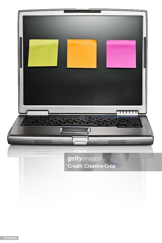 Computer / laptop, three adhesive notes on screen