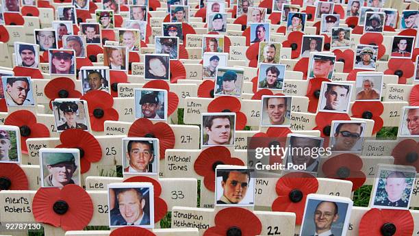 Faces adorn crosses placed in the Garden of Remembrance of some of Britain's armed forces members who have died in Afghanistan in the Garden of...