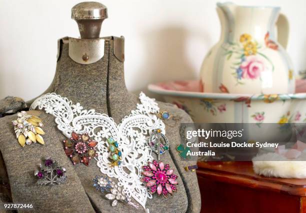 vintage dressmakers dummy with old brooches - the penrose stock pictures, royalty-free photos & images