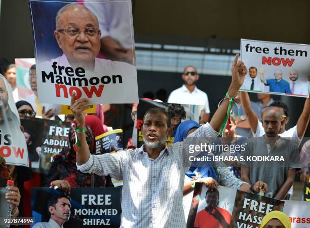Supporters of former Maldivian president Mohamed Nasheed shout slogans during a protest against the current Maldives President Abdulla Yameen,...