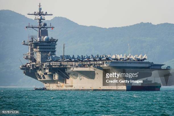 The United States aircraft carrier, USS Carl Vinson, anchored off the coast at Tien Sa Port on March 5, 2018 in Danang, Vietnam. A United States...
