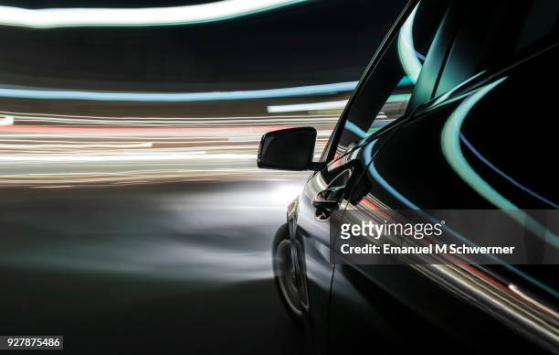 black german car drives through the city of munich - shiny car stock pictures, royalty-free photos & images
