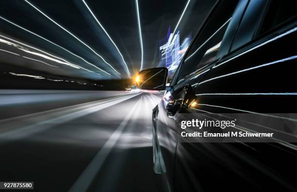 black german car drives through the city of munich - autoperspektive stock-fotos und bilder