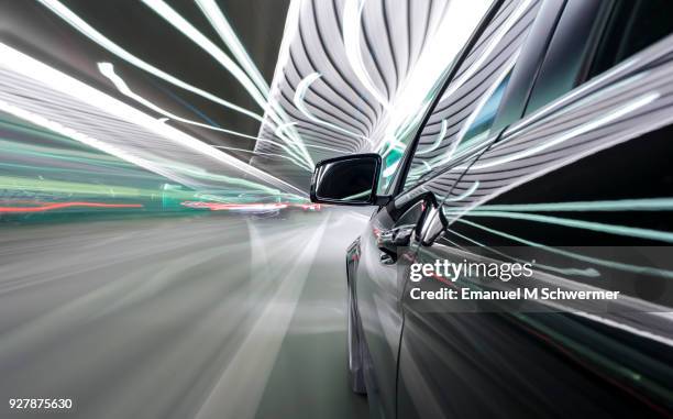 black german car drives through a modern tunnel - autonomous car stockfoto's en -beelden