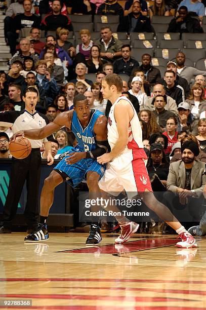 Dwight Howard of the Orlando Magic goes up against Rasho Nesterovic of the Toronto Raptors during the game on November 1, 2009 at Air Canada Centre...