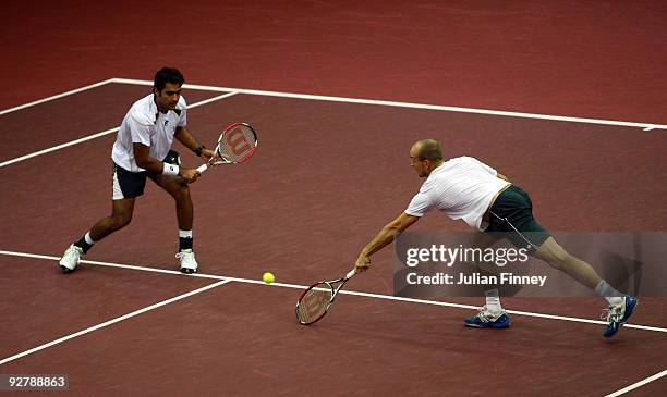 James Cerretani of USA and Aisam-Ul-Haq Qureshi of Pakistan in action against Nenad Zimonjic of Serbia and Daniel Nestor of Canada during Day Four of...